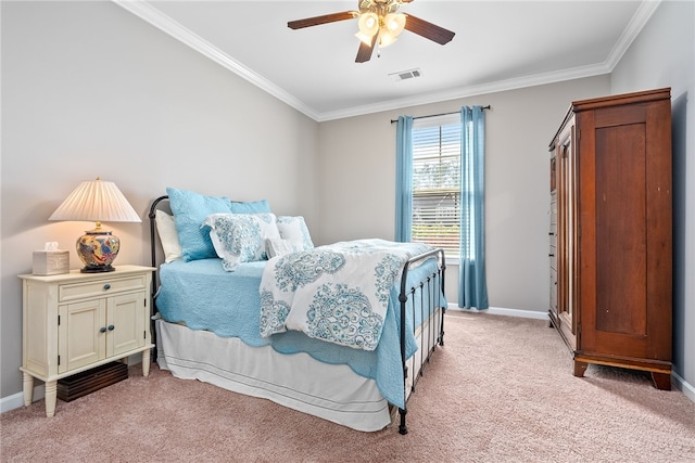 bedroom featuring crown molding, baseboards, visible vents, and light carpet