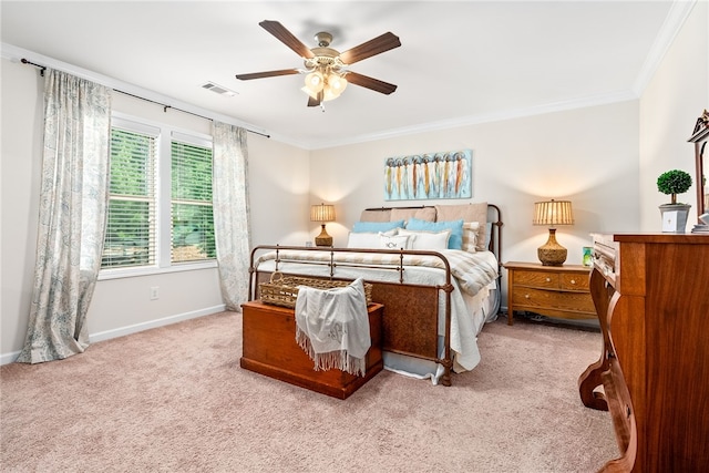 bedroom featuring crown molding, light carpet, and visible vents