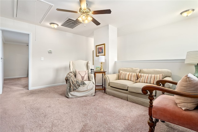 sitting room featuring ceiling fan, attic access, visible vents, baseboards, and carpet