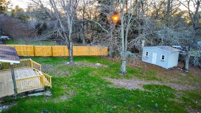 view of yard with a storage unit and a wooden deck