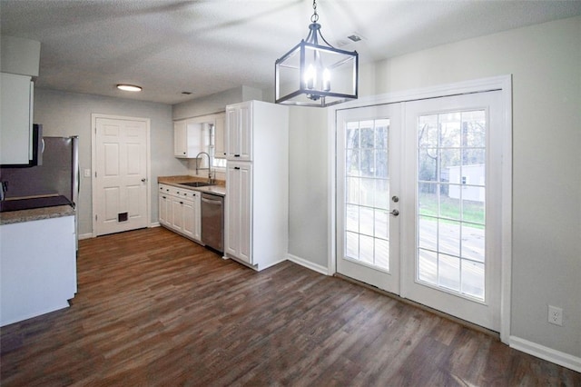 kitchen with white cabinetry, sink, french doors, pendant lighting, and appliances with stainless steel finishes