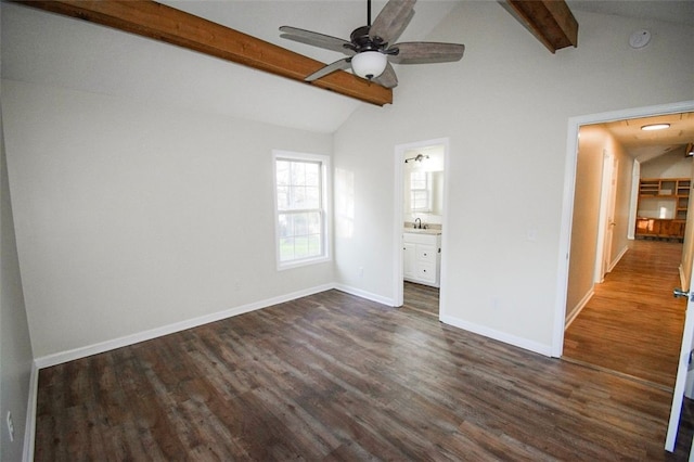 unfurnished bedroom featuring vaulted ceiling with beams, ceiling fan, dark hardwood / wood-style flooring, and ensuite bathroom