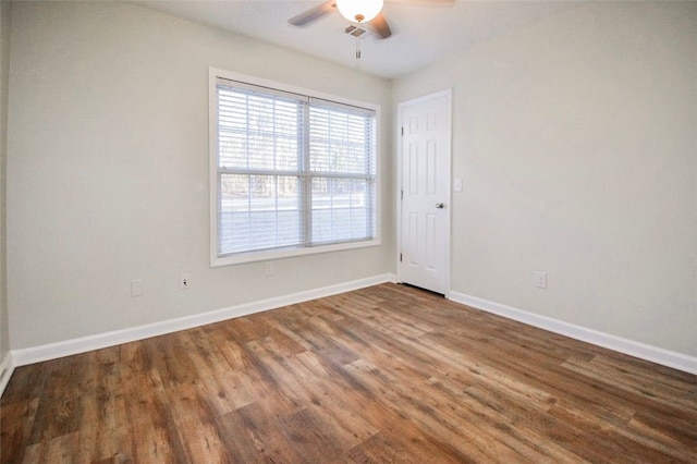 empty room featuring hardwood / wood-style flooring and ceiling fan