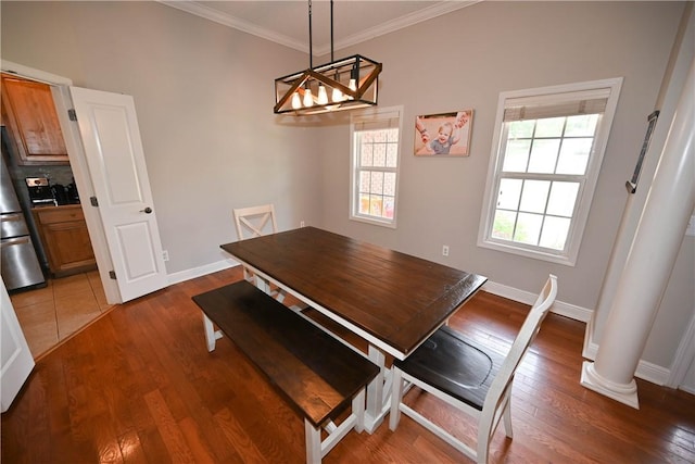 321 Saint James Dr, Auburn, AL 36830 - dining area featuring an inviting chandelier, baseboards, ornamental molding, and wood finished floors