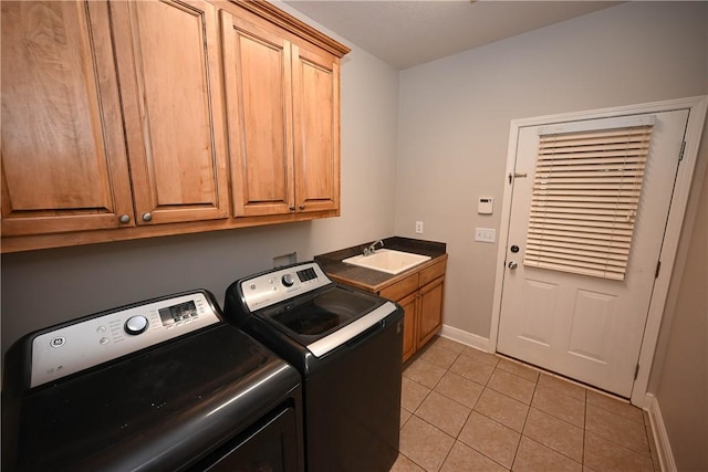 321 Saint James Dr, Auburn, AL 36830 - laundry room featuring light tile patterned flooring, baseboards, a sink, cabinet space, and independent washer and dryer