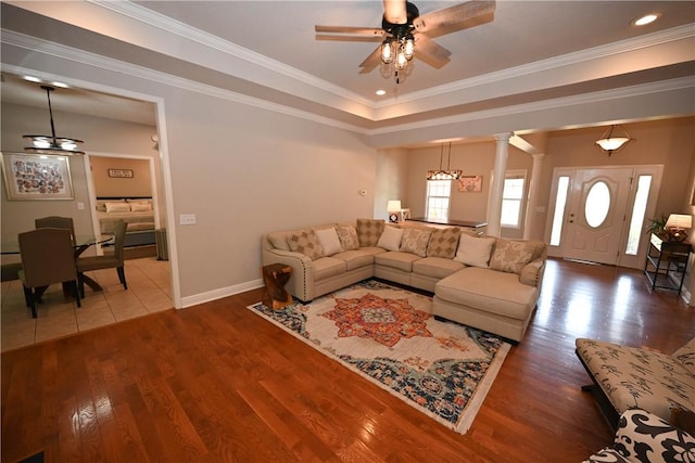 321 Saint James Dr, Auburn, AL 36830 - living room with baseboards, ceiling fan, ornate columns, and wood finished floors