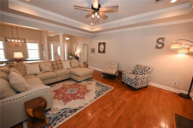321 Saint James Dr, Auburn, AL 36830 - living room featuring crown molding, a raised ceiling, a ceiling fan, baseboards, and wood finished floors