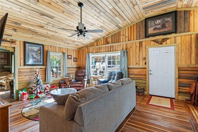 living room with wood ceiling, ceiling fan, wooden walls, hardwood / wood-style floors, and lofted ceiling