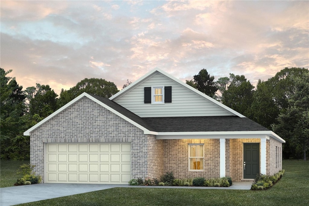 956 Como Way, Opelika, AL 36804 - view of front of home with brick siding, an attached garage, driveway, a lawn, and roof with shingles