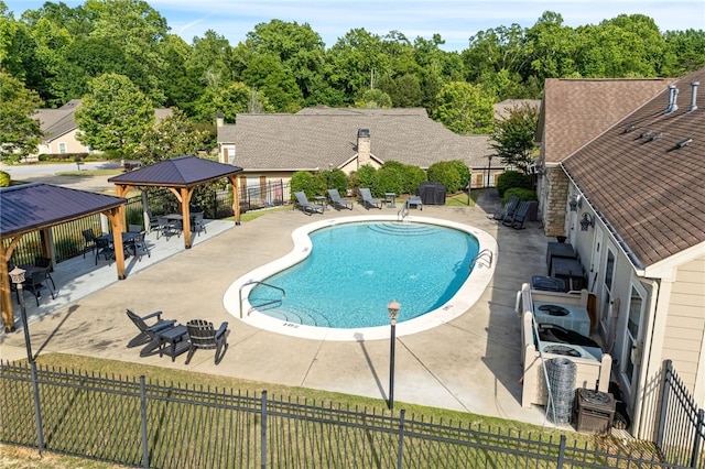 3000 Alumni Ln, Opelika, AL 36804 - community pool featuring a gazebo, a patio, fence, and central AC