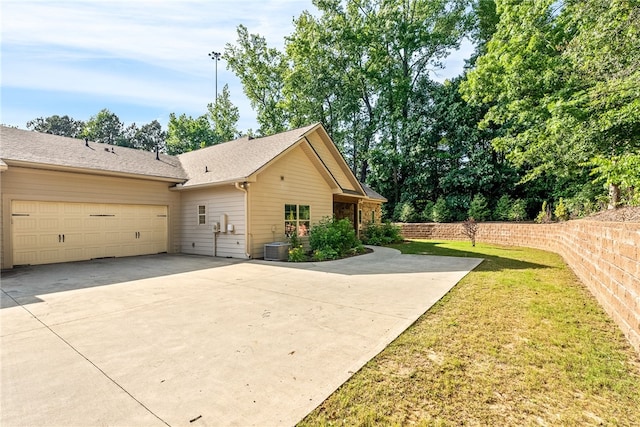 3000 Alumni Ln, Opelika, AL 36804 - view of property exterior with concrete driveway, a yard, and an attached garage