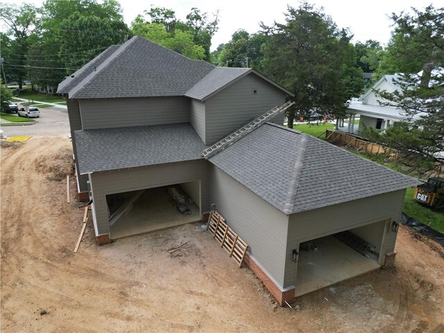 410 Geneva St, Opelika, AL 36801 - view of property exterior featuring a shingled roof