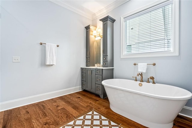 2051 Moores Mill Rd Unit K, Auburn, AL 36830 - full bath with vanity, a freestanding tub, wood finished floors, and crown molding