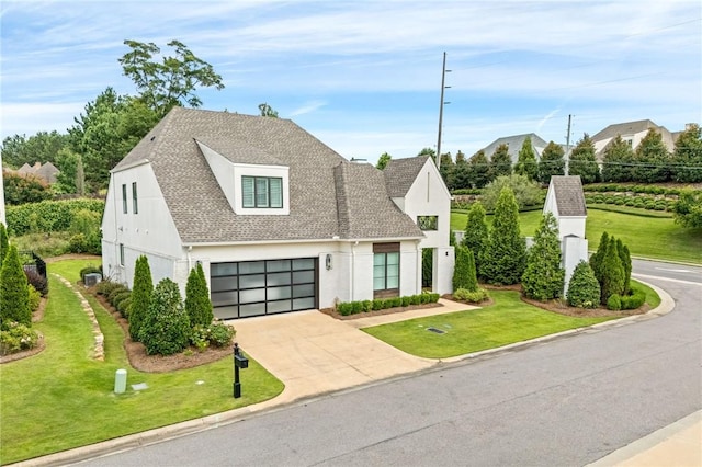 2051 Moores Mill Rd Unit K, Auburn, AL 36830 - view of front facade featuring a front lawn, driveway, roof with shingles, and stucco siding