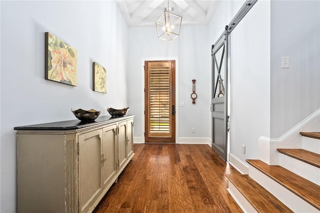 2051 Moores Mill Rd Unit K, Auburn, AL 36830 - entryway with dark wood finished floors, a barn door, stairs, a chandelier, and beam ceiling