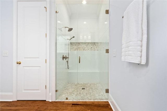 2051 Moores Mill Rd Unit K, Auburn, AL 36830 - bathroom featuring a stall shower and wood finished floors