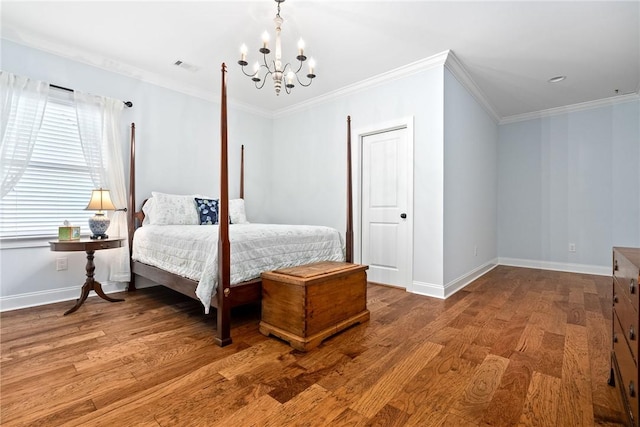 2051 Moores Mill Rd Unit K, Auburn, AL 36830 - bedroom with a chandelier, wood finished floors, and crown molding