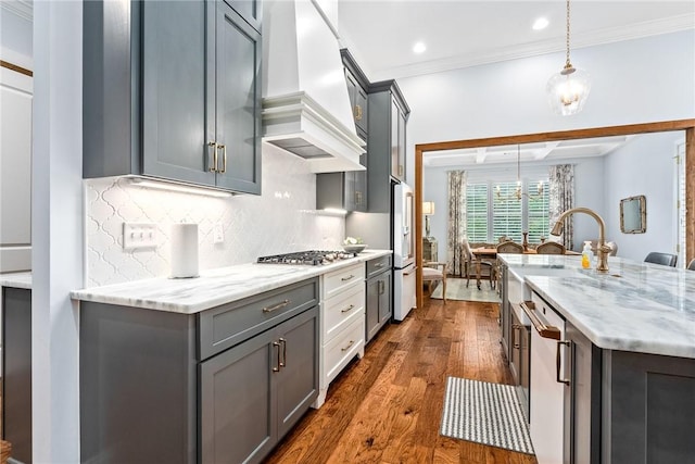 2051 Moores Mill Rd Unit K, Auburn, AL 36830 - kitchen featuring custom exhaust hood, crown molding, stainless steel gas stovetop, gray cabinetry, and backsplash