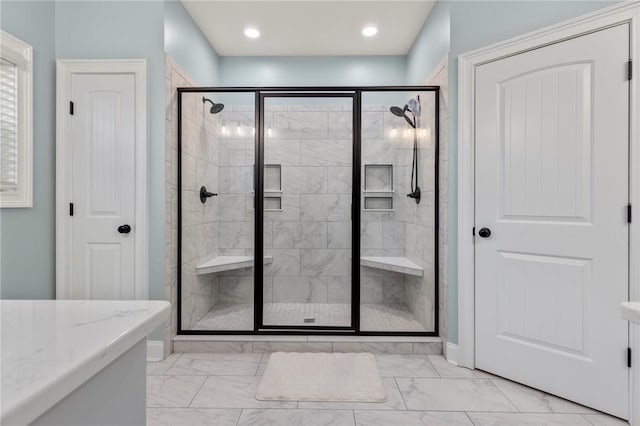 bathroom with walk in shower and vanity