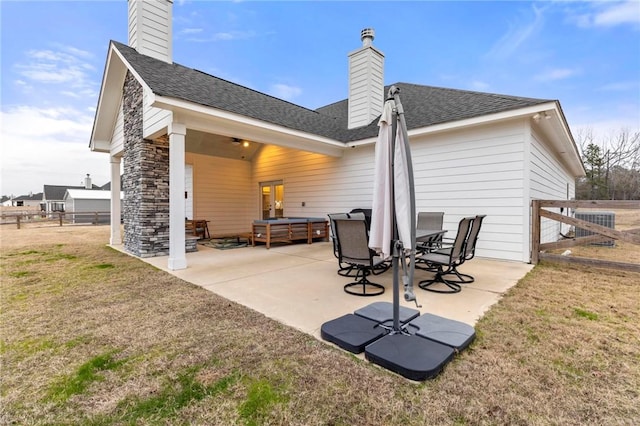 back of property with a patio area, a yard, and central air condition unit