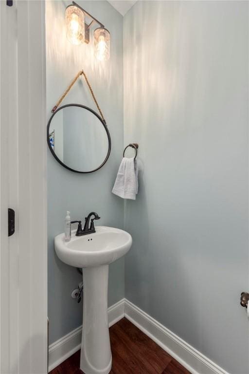 bathroom with wood-type flooring