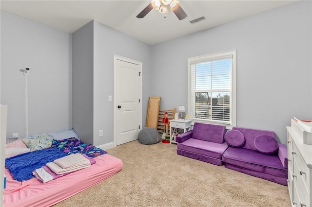 carpeted bedroom with ceiling fan