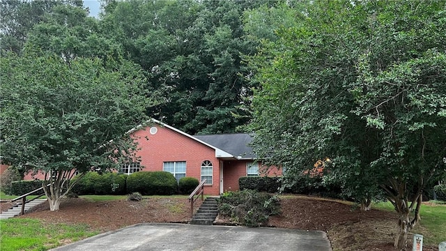1181/1183 Northlake Dr, Auburn, AL 36830 - view of front of house with brick siding, stairway, and roof with shingles