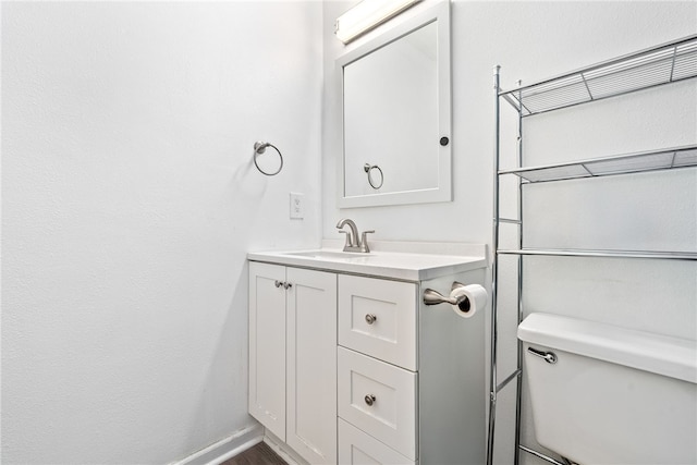 1761 Wire Rd Unit 411, Auburn, AL 26832 - bathroom with vanity, toilet, wood finished floors, and baseboards