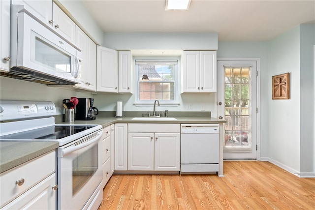 1761 Wire Rd Unit 411, Auburn, AL 26832 - kitchen with white appliances, a sink, light wood-type flooring, and white cabinets