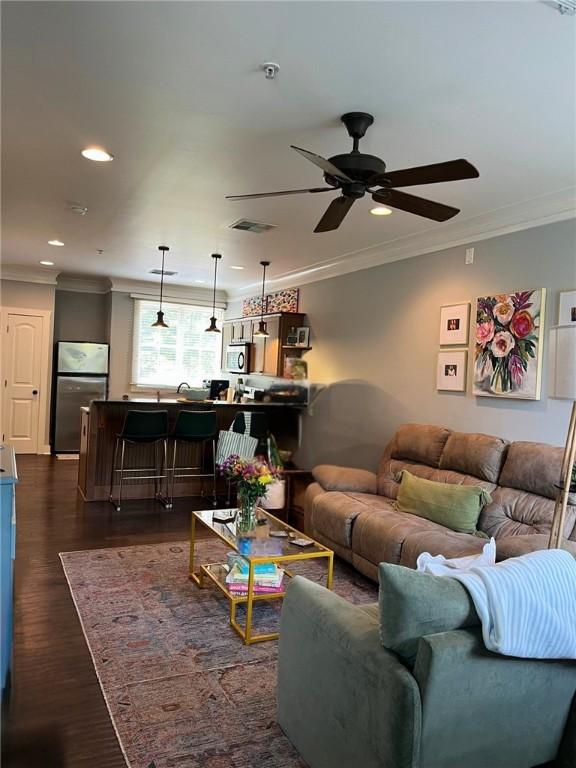 650 Dekalb St Unit 2213, Auburn, AL 36830 - living area with crown molding, ceiling fan, recessed lighting, and dark wood-style flooring