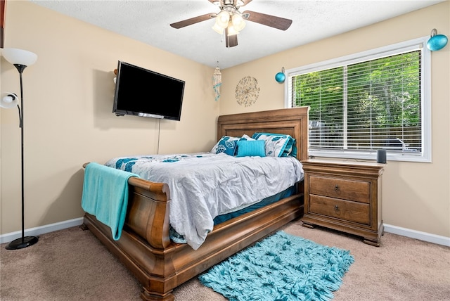 522 N Donahue Dr Unit 2, Auburn, AL 36830 - carpeted bedroom with a ceiling fan and a textured ceiling