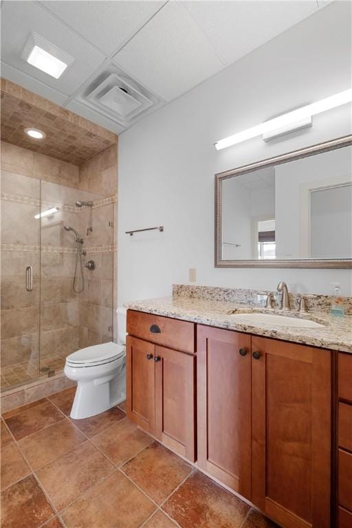 bathroom with vanity, an enclosed shower, and toilet