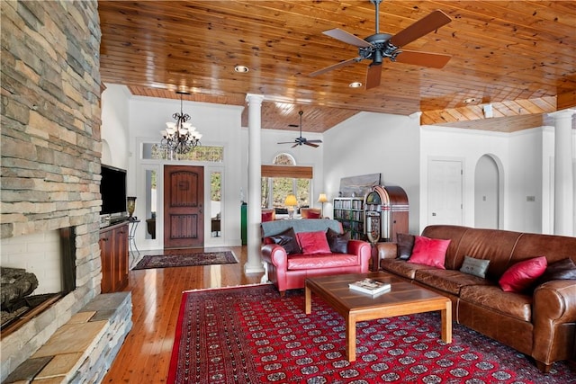 living room with hardwood / wood-style floors, ornate columns, and wooden ceiling