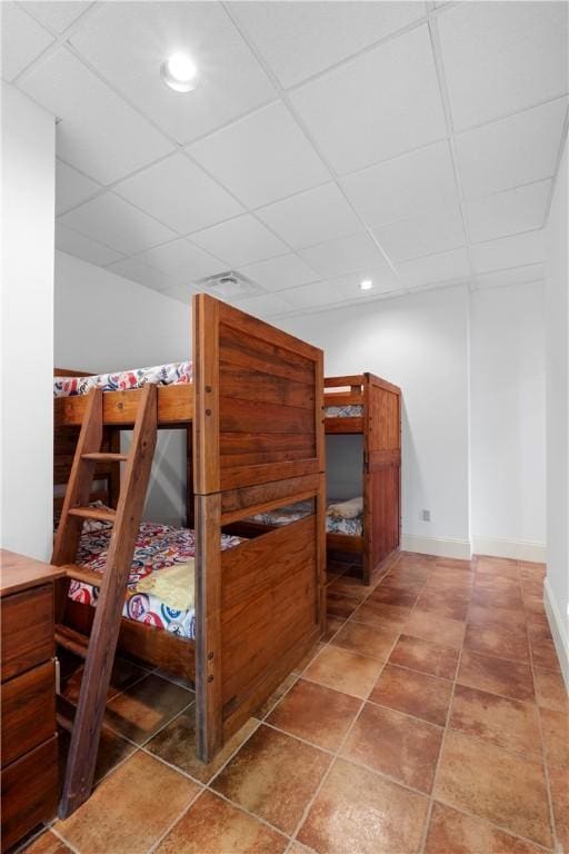 bedroom featuring a drop ceiling