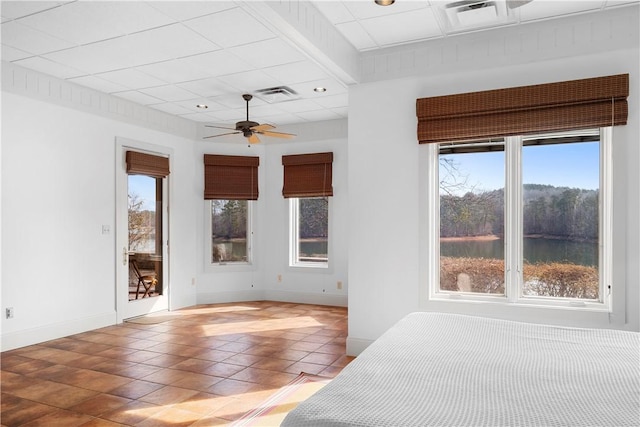 unfurnished room featuring ceiling fan and tile patterned floors