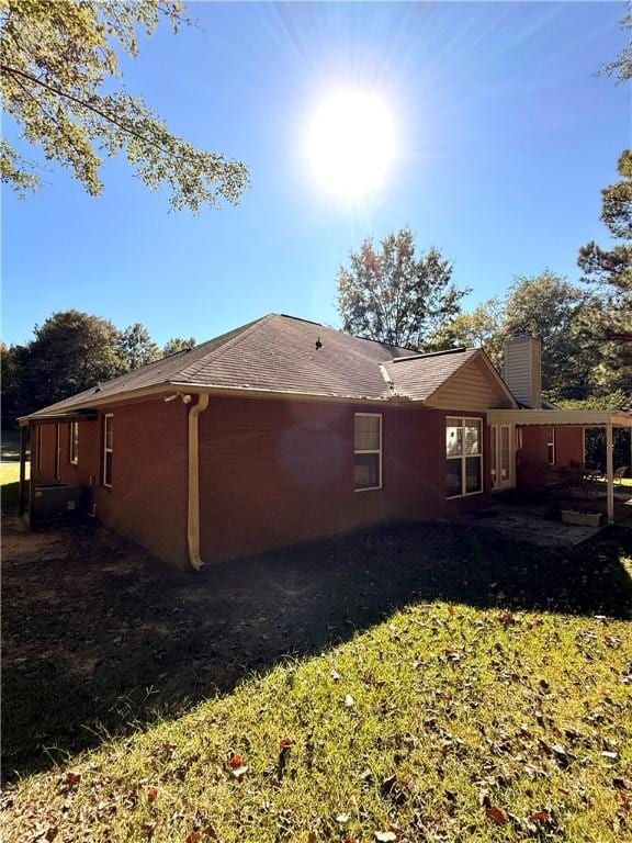 view of side of property with a chimney