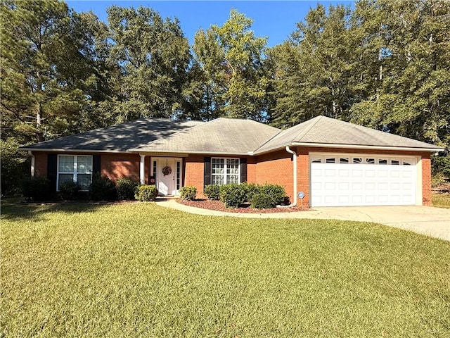 single story home with concrete driveway, an attached garage, brick siding, and a front yard