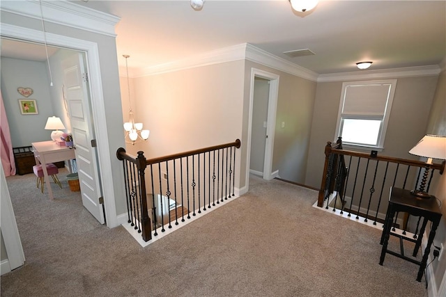 261 Woodward Way, Auburn, AL 36832 - hall featuring an upstairs landing, carpet floors, ornamental molding, and a chandelier