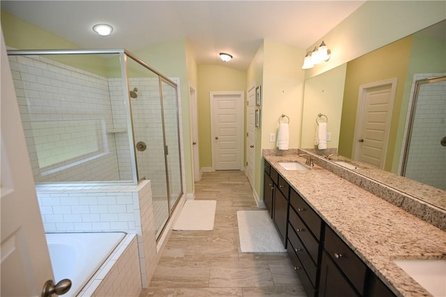261 Woodward Way, Auburn, AL 36832 - bathroom with a stall shower, double vanity, a bath, and baseboards