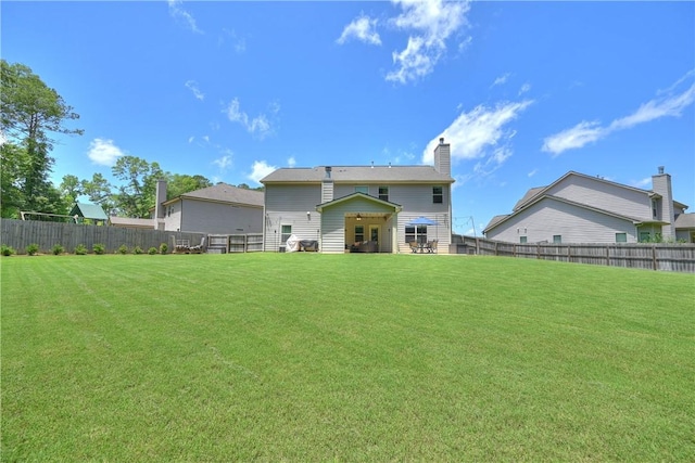 261 Woodward Way, Auburn, AL 36832 - rear view of house featuring a chimney