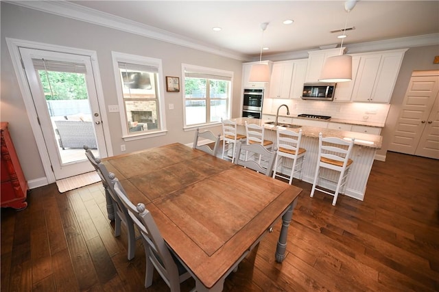 261 Woodward Way, Auburn, AL 36832 - dining area with healthy amount of natural light, dark wood finished floors, crown molding, recessed lighting, and baseboards
