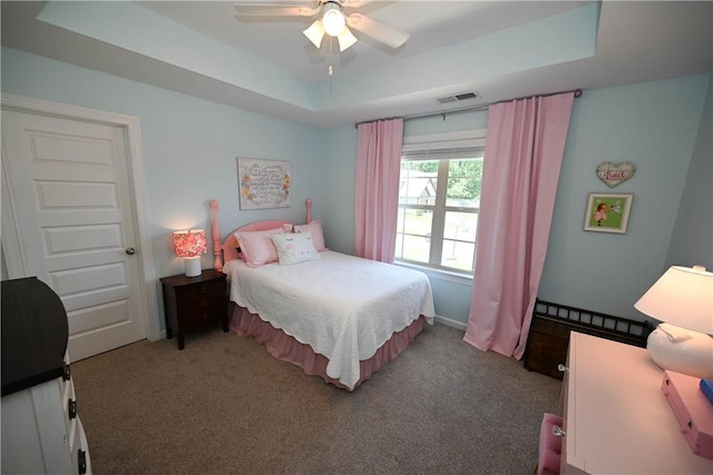 261 Woodward Way, Auburn, AL 36832 - bedroom with a raised ceiling, carpet flooring, and a ceiling fan