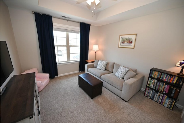 261 Woodward Way, Auburn, AL 36832 - carpeted living room with a ceiling fan, baseboards, and a tray ceiling