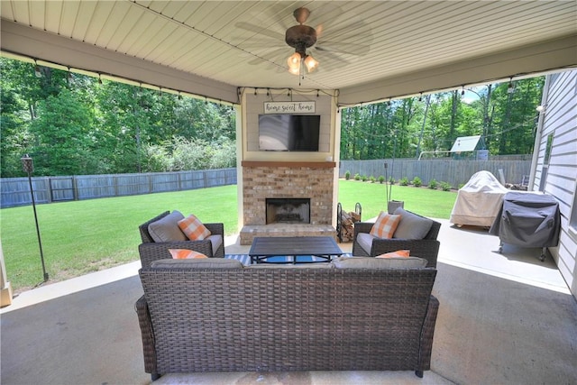 261 Woodward Way, Auburn, AL 36832 - view of patio featuring an outdoor living space with a fireplace, ceiling fan, and view of scattered trees