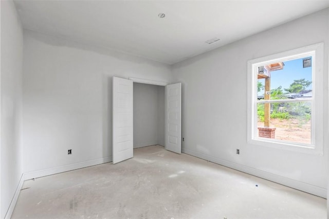 208 Byrd Ave, Opelika, AL 36801 - unfurnished bedroom with concrete flooring and baseboards