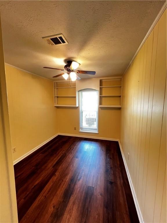 1128 Overwood Pl, Auburn, AL 36830 - spare room with a ceiling fan, a textured ceiling, and dark wood-style flooring