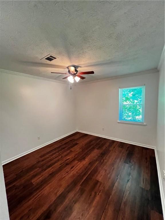 1128 Overwood Pl, Auburn, AL 36830 - unfurnished room with crown molding, ceiling fan, a textured ceiling, and dark wood-style floors