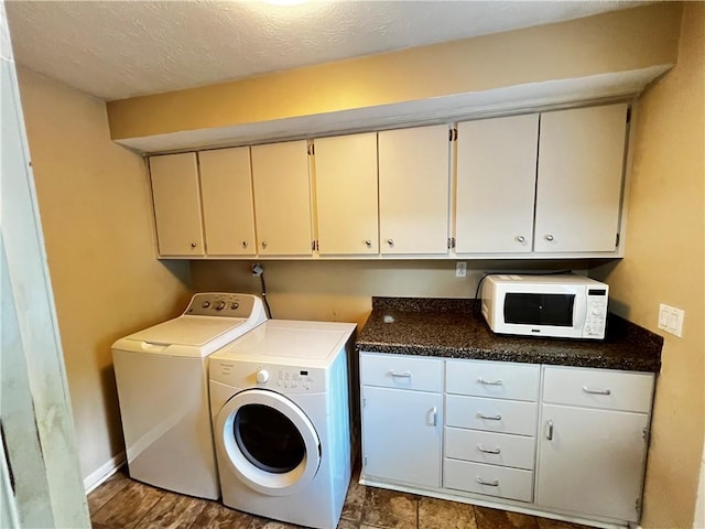 1128 Overwood Pl, Auburn, AL 36830 - laundry area featuring cabinet space, separate washer and dryer, and a textured ceiling