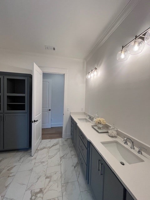 bathroom with vanity and crown molding