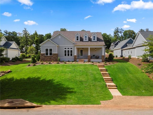 view of front of home featuring a porch and a front lawn